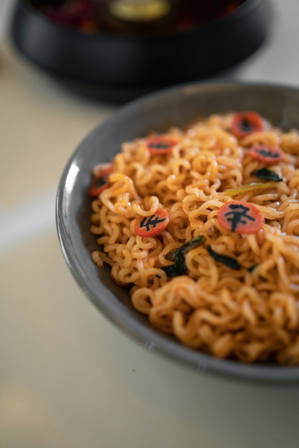 a bowl of noodles with sprinkles on it