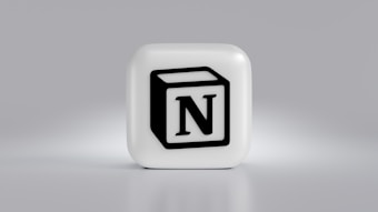 A cube-shaped object with a prominent black N logo in the center, set against a light gray background. The cube is three-dimensional with a smooth, white surface.
