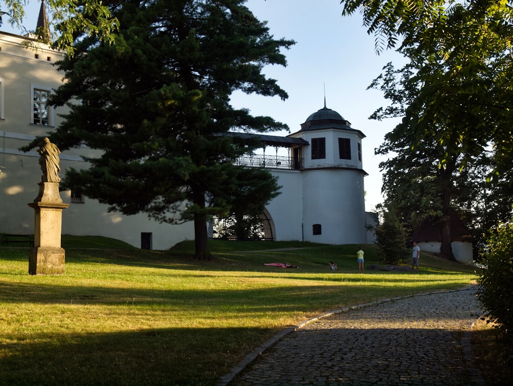 a large white building with a clock tower