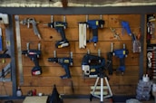 a wooden wall with tools hanging on it