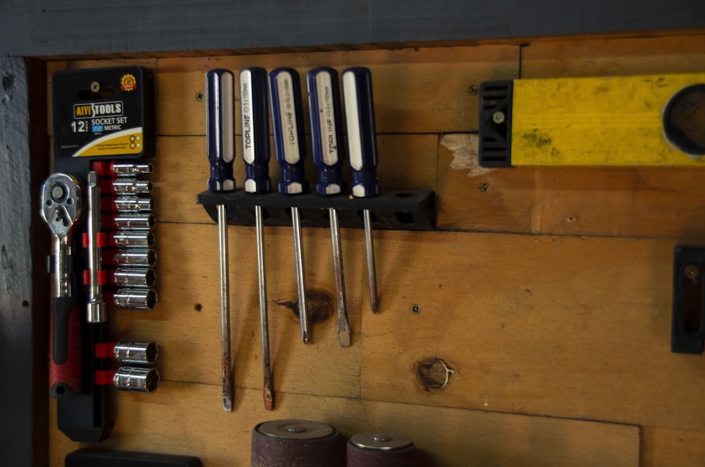 a bunch of tools hanging on a wall