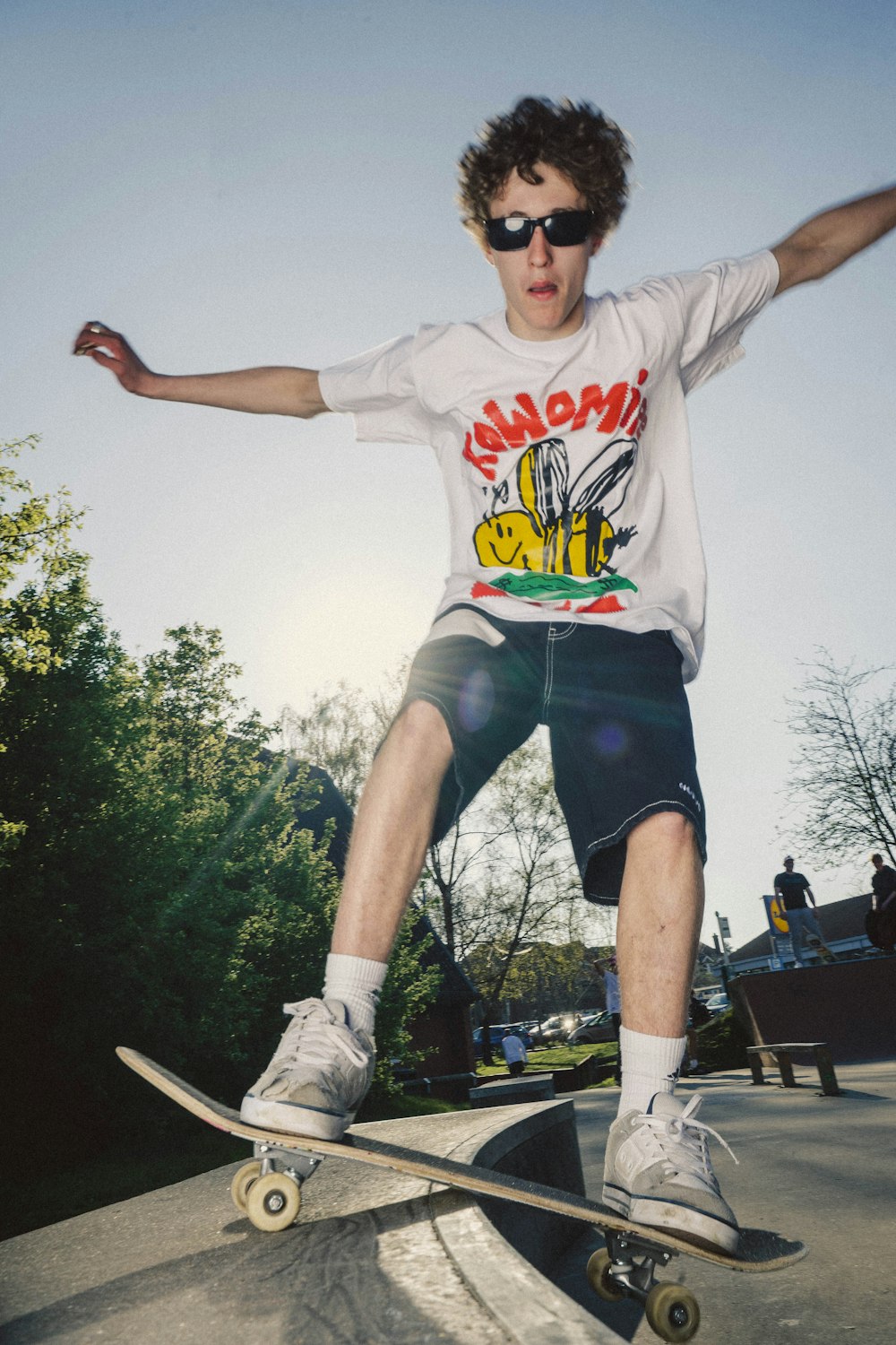 a man riding a skateboard on top of a ramp