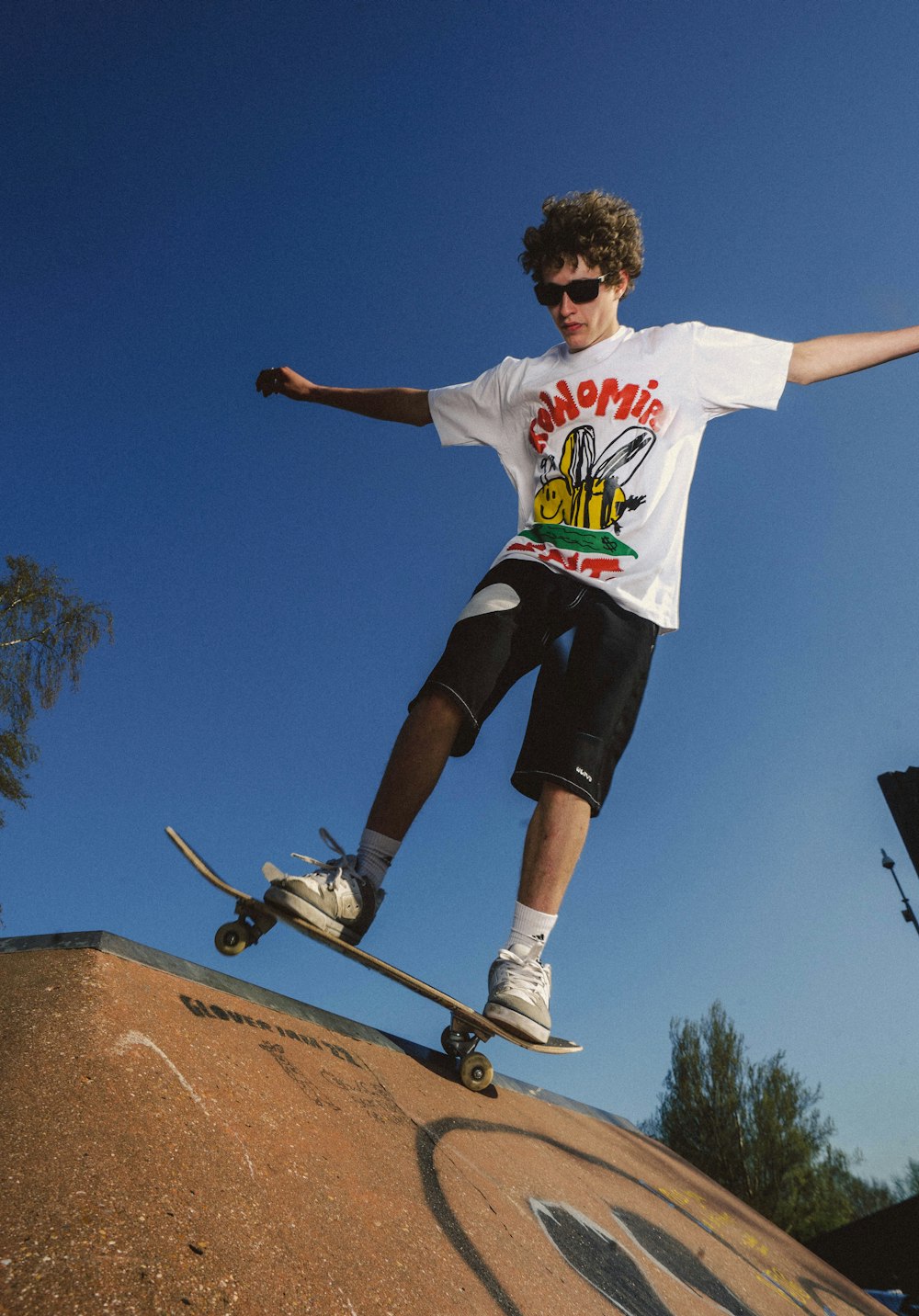 a man riding a skateboard up the side of a ramp