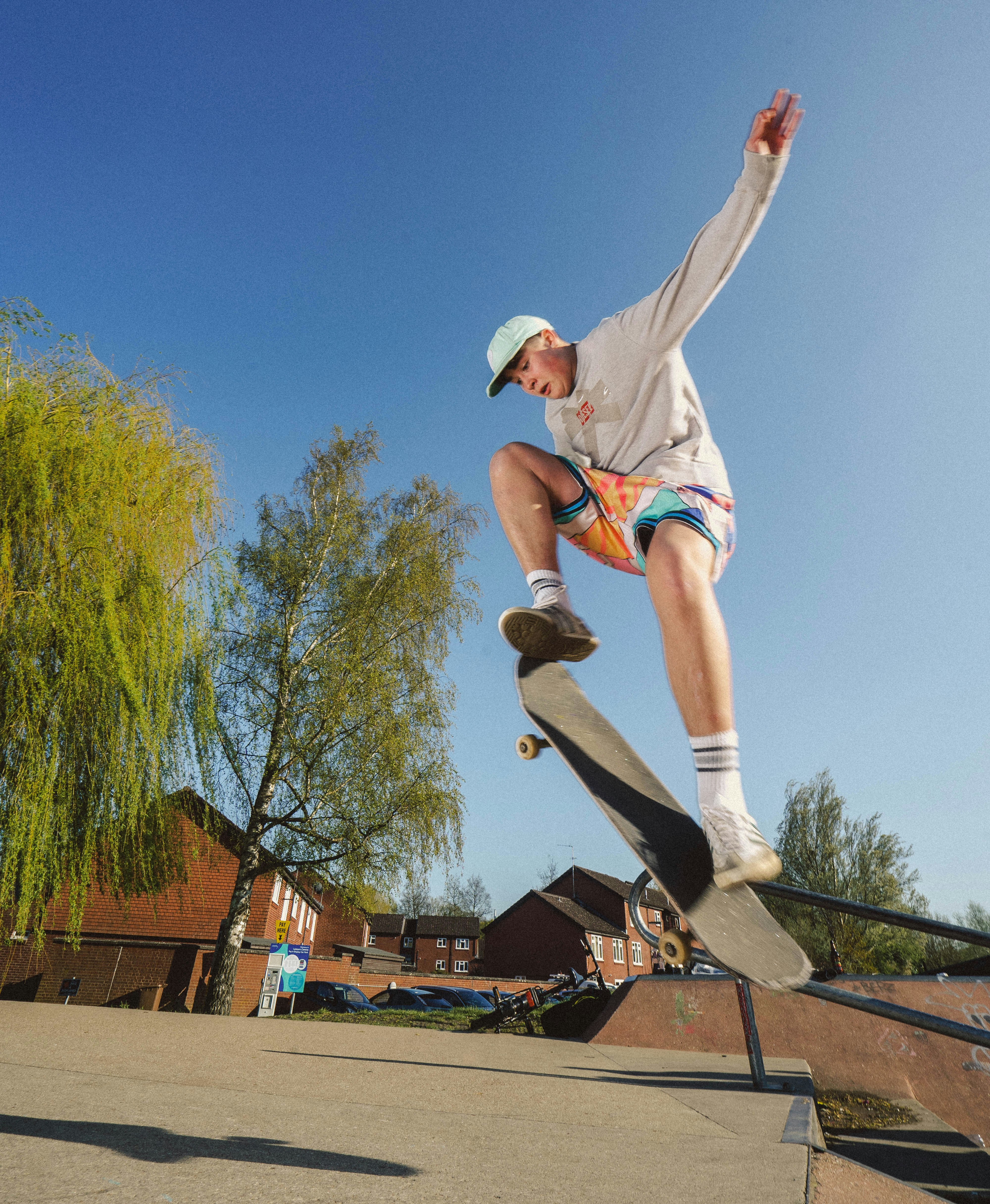 a man riding a skateboard up the side of a rail