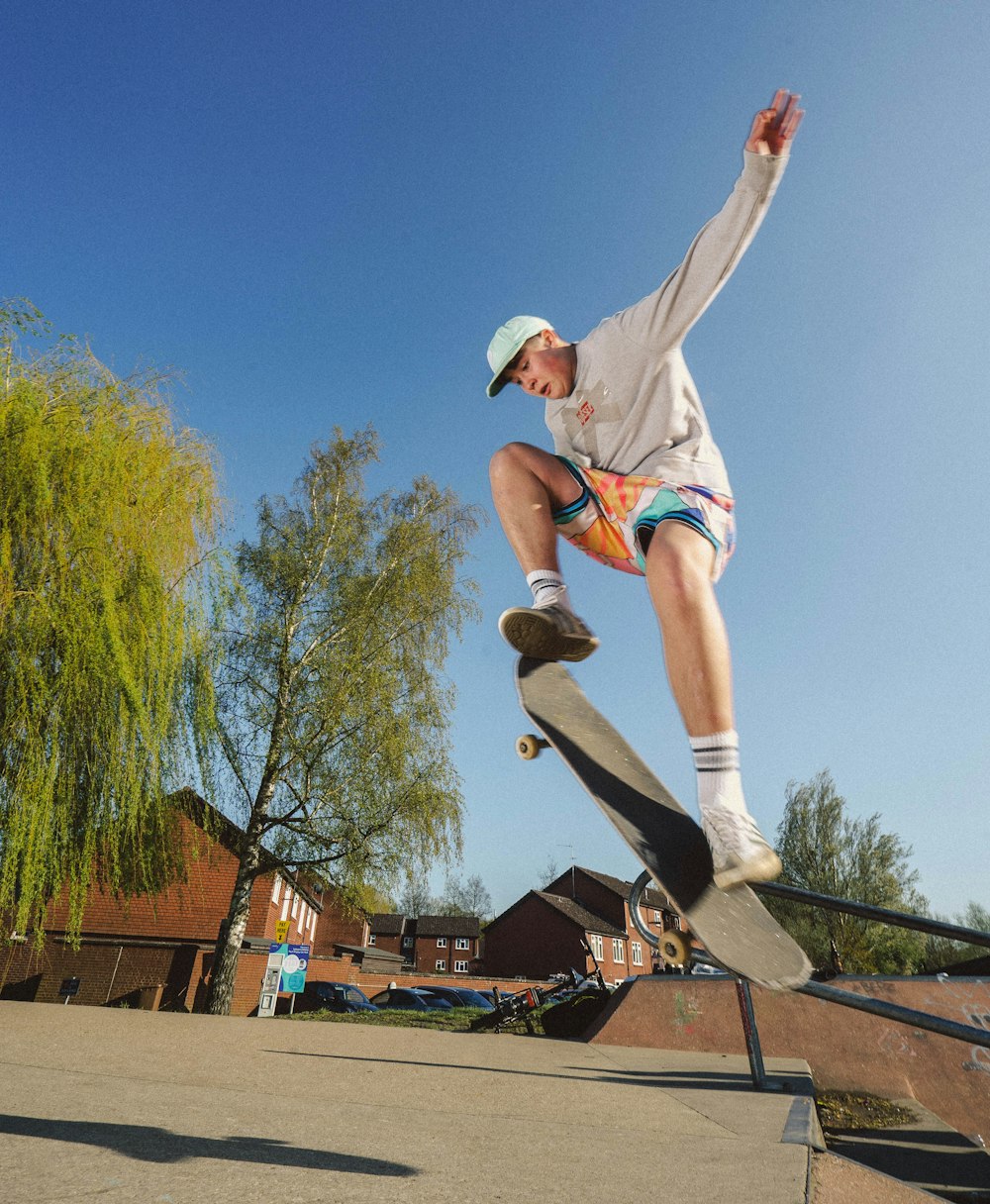 a man riding a skateboard up the side of a rail
