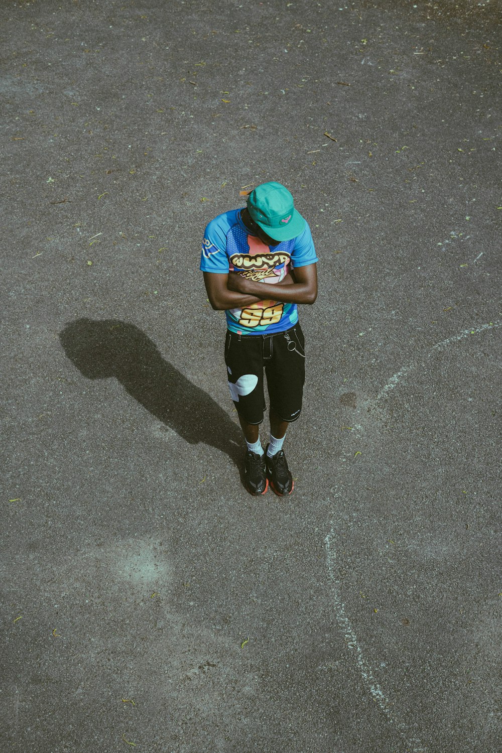 a man in a blue shirt holding a plate of food