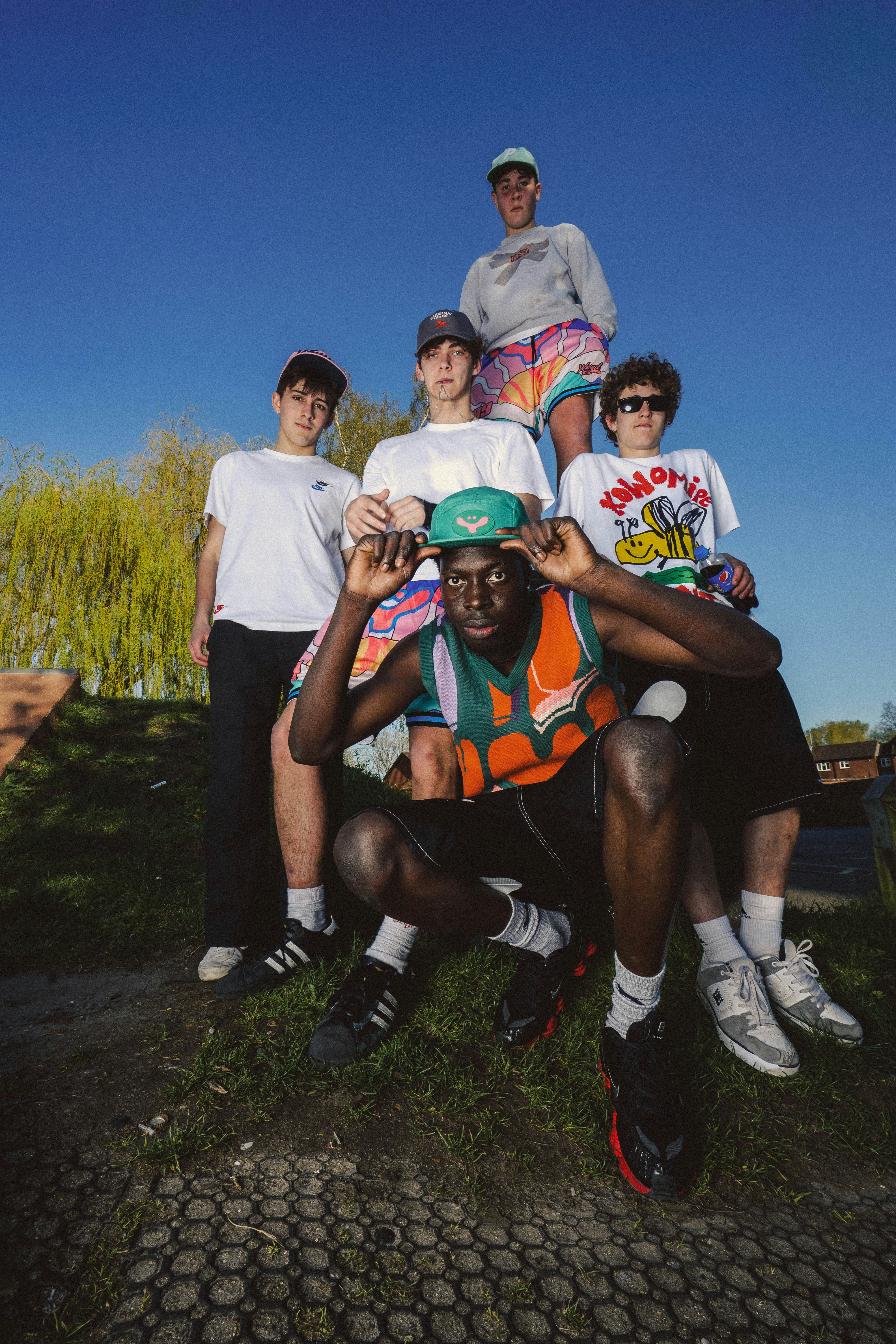 a group of young men standing next to each other