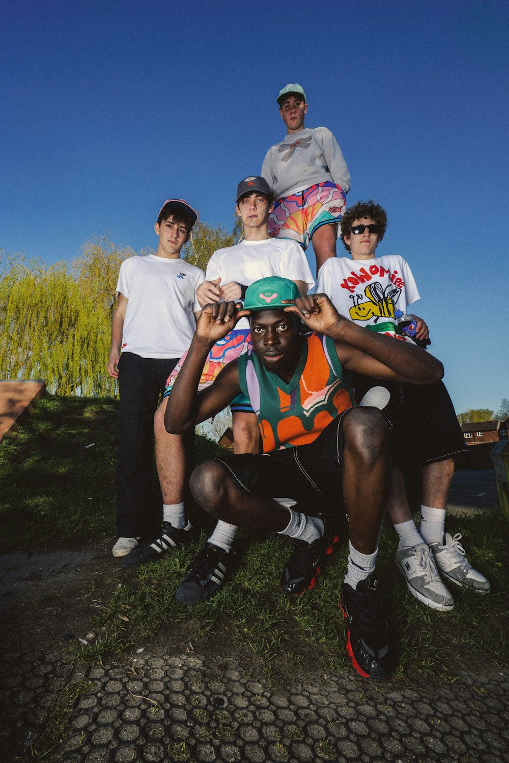 a group of young men standing next to each other