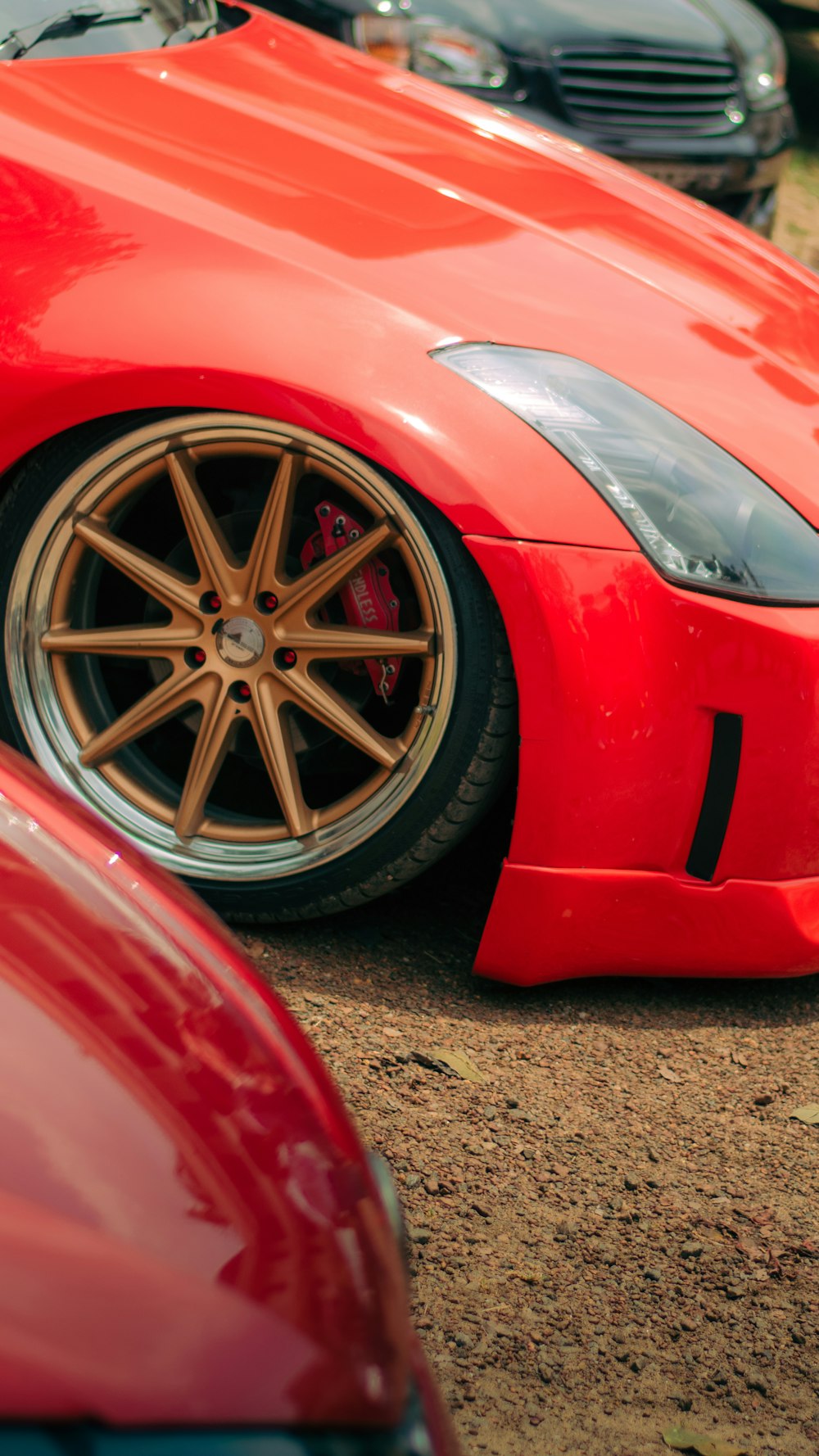 a red sports car parked in a parking lot