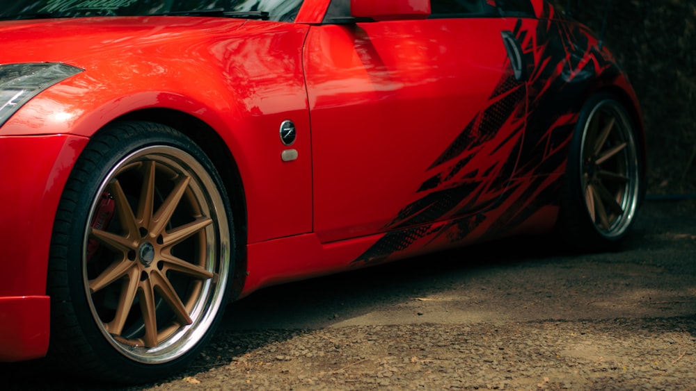 a red sports car parked in a parking lot