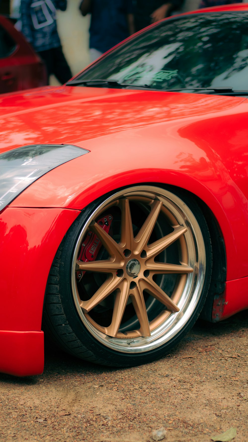 a red sports car parked in a parking lot