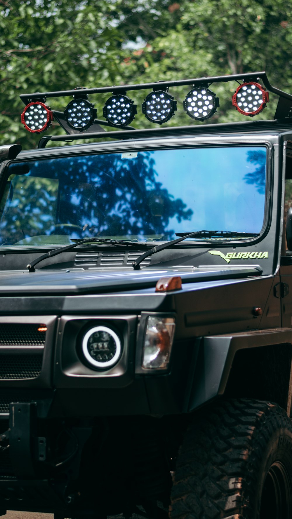 a black vehicle with a light on top of it