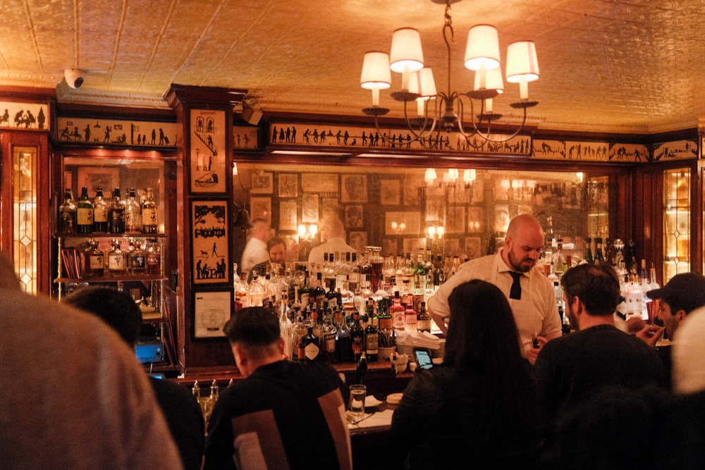 a group of people sitting at a bar