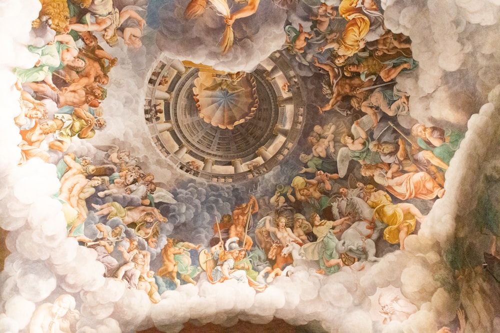 the ceiling of a building with a painting on it