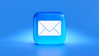 a blue button with a white envelope on it
