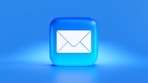 a blue button with a white envelope on it
