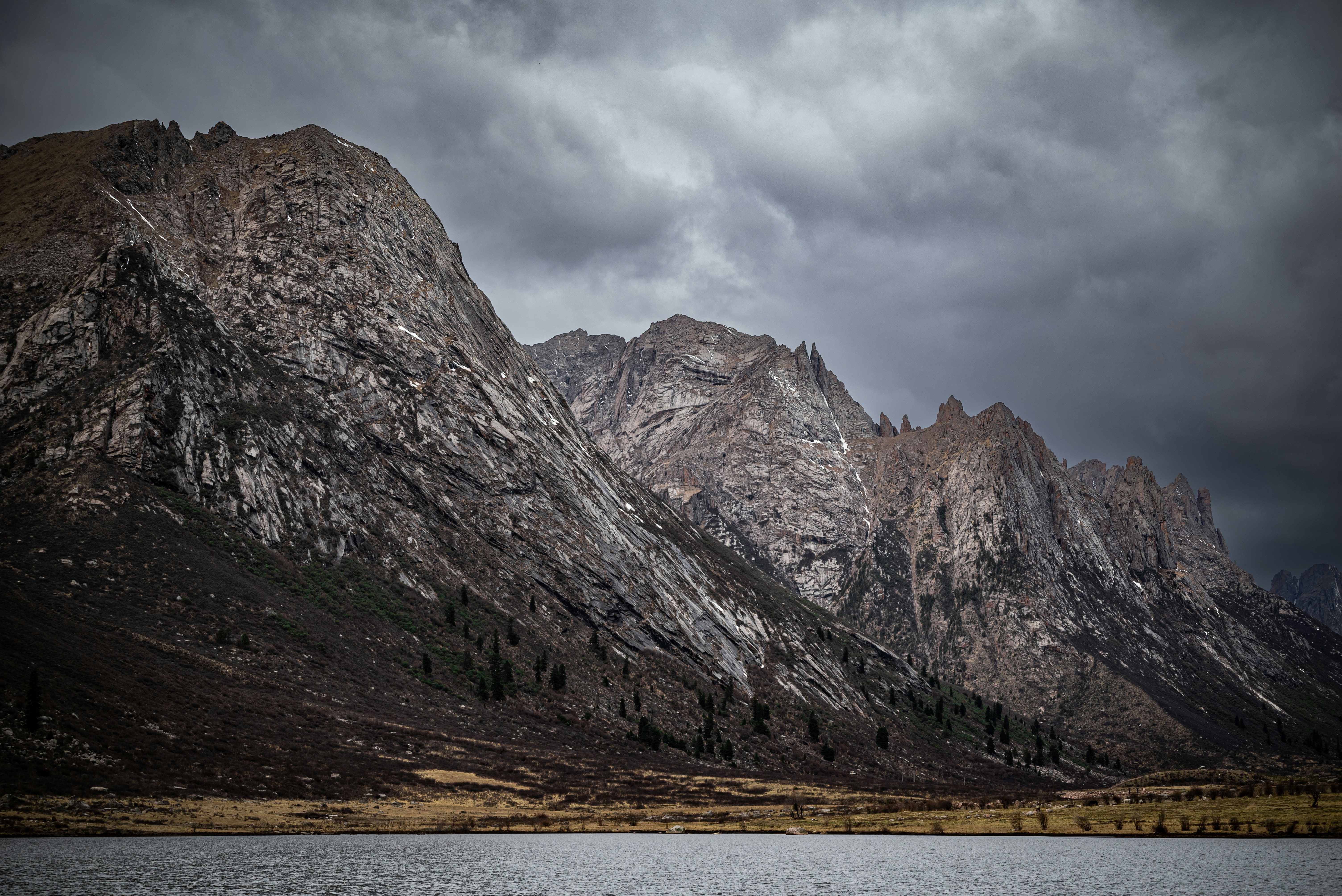 a mountain range with a body of water in front of it