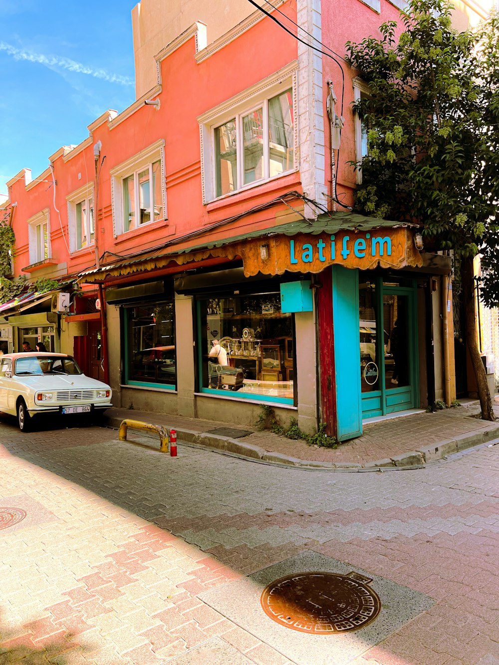 a car is parked in front of a store