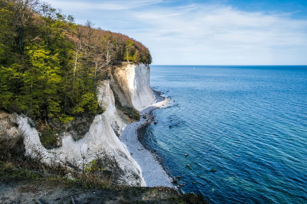 a view of a beach with a cliff on the side of it