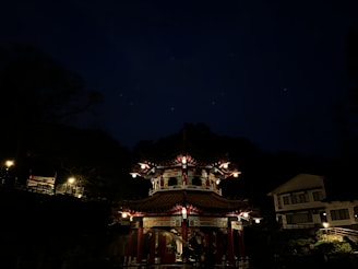An advanced pavilion glowing softly at dusk, highlighting layered translucency and structural elegance.
