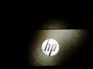 a close up of a hp logo on a laptop