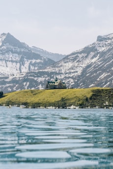 A dignified Freemason lodge building bathed in early morning light, nestled in a serene Montérégie valley landscape.