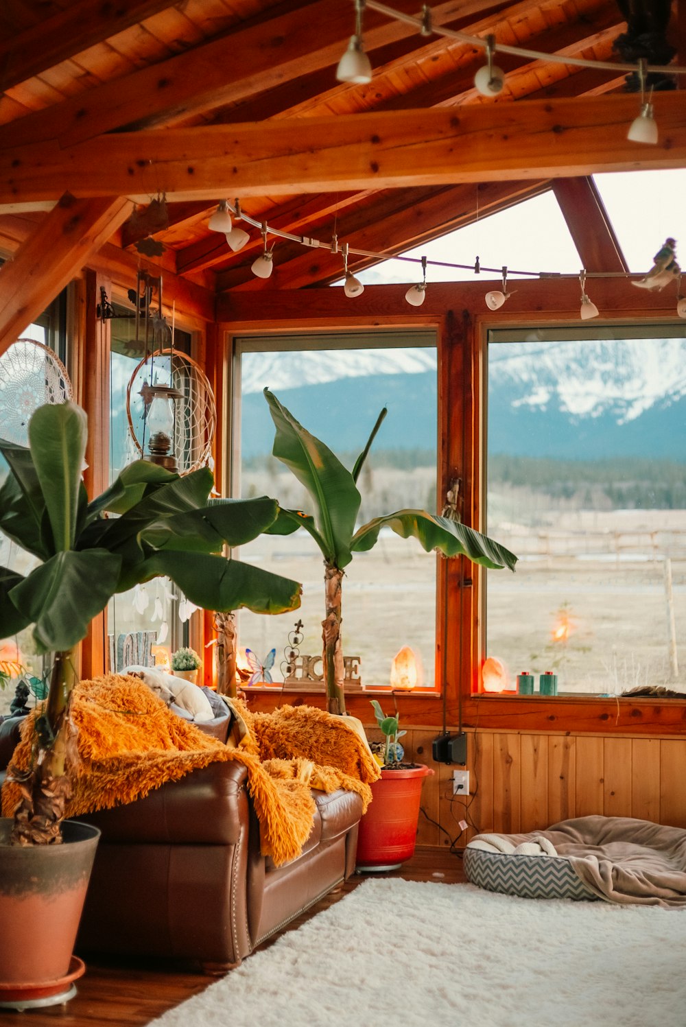 a living room filled with furniture and a large window