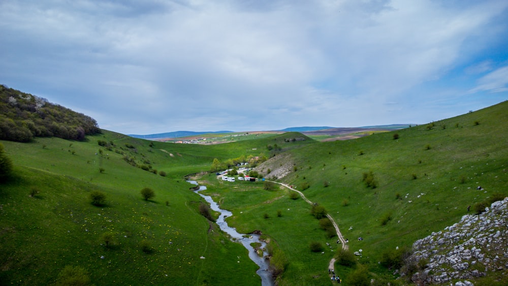 a river running through a lush green valley