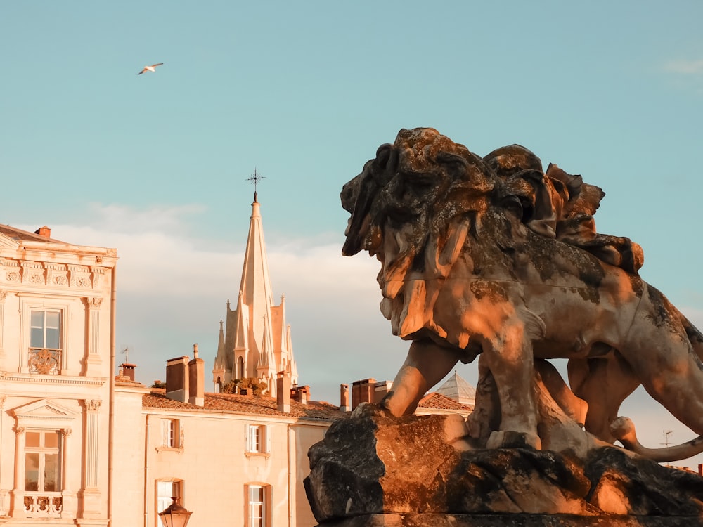 a statue of a lion in front of a church