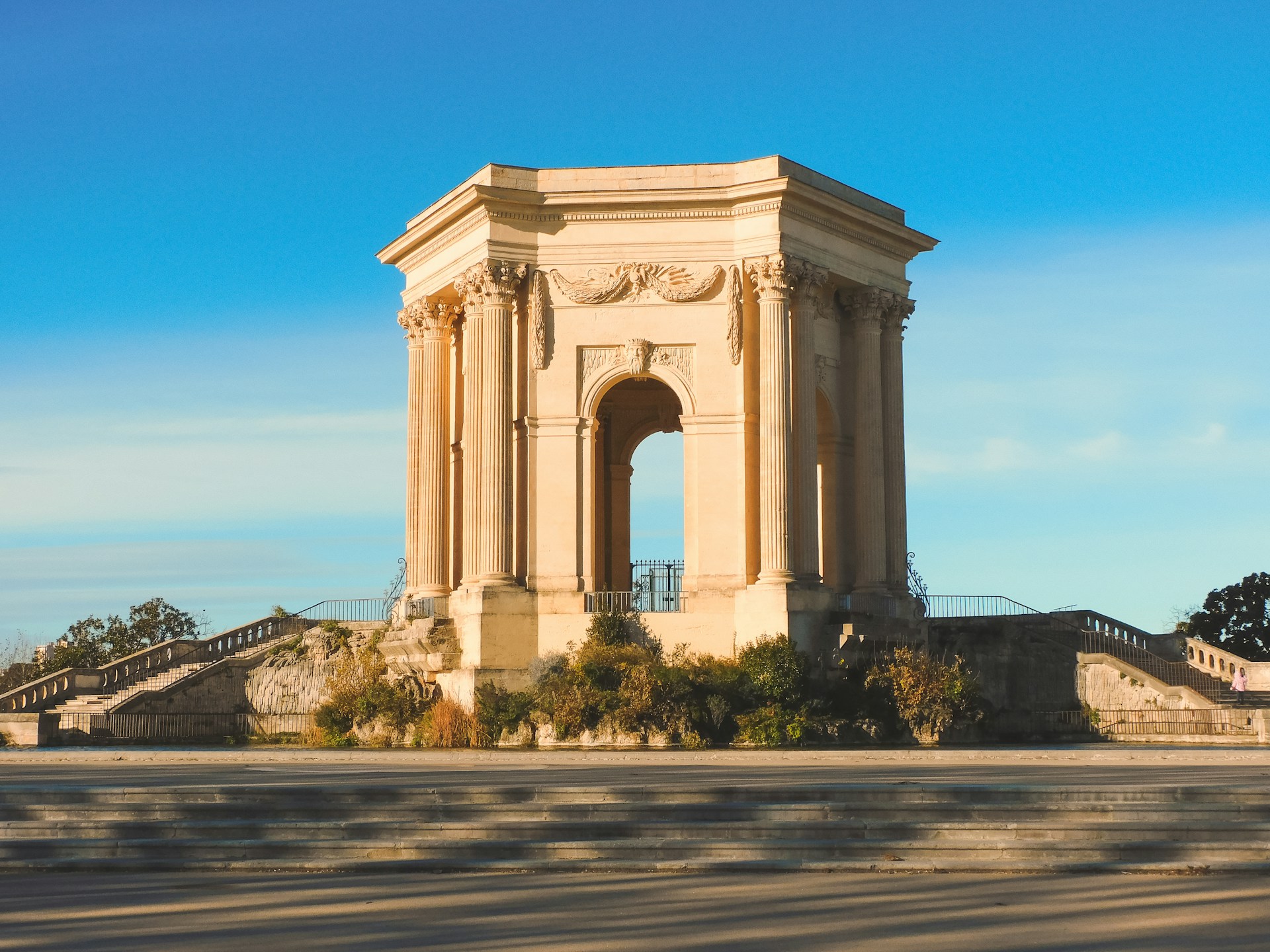 a large monument with a clock on top of it