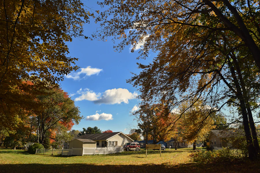 Two story home framed by fall color in Delaware