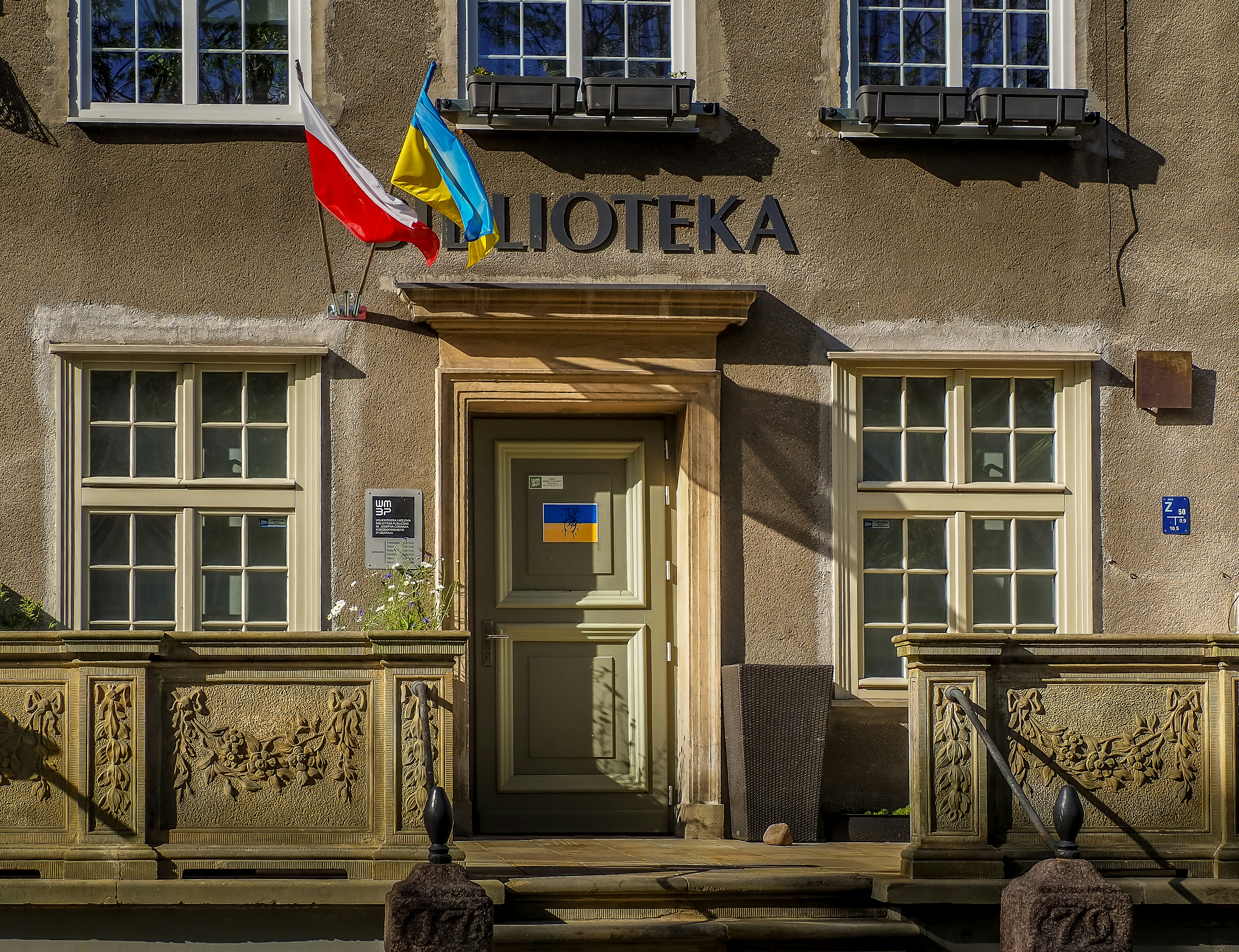 a building with two flags on top of it