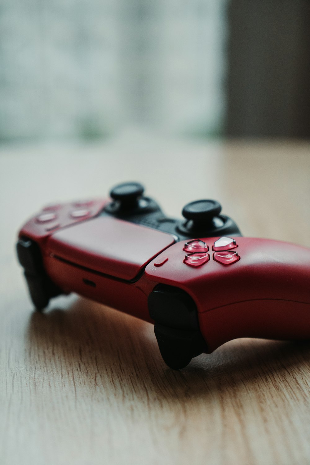 a close up of a video game controller on a table