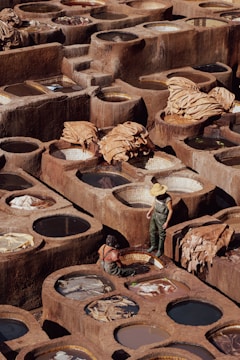 Workers collaborating in a sustainable leather production workshop.