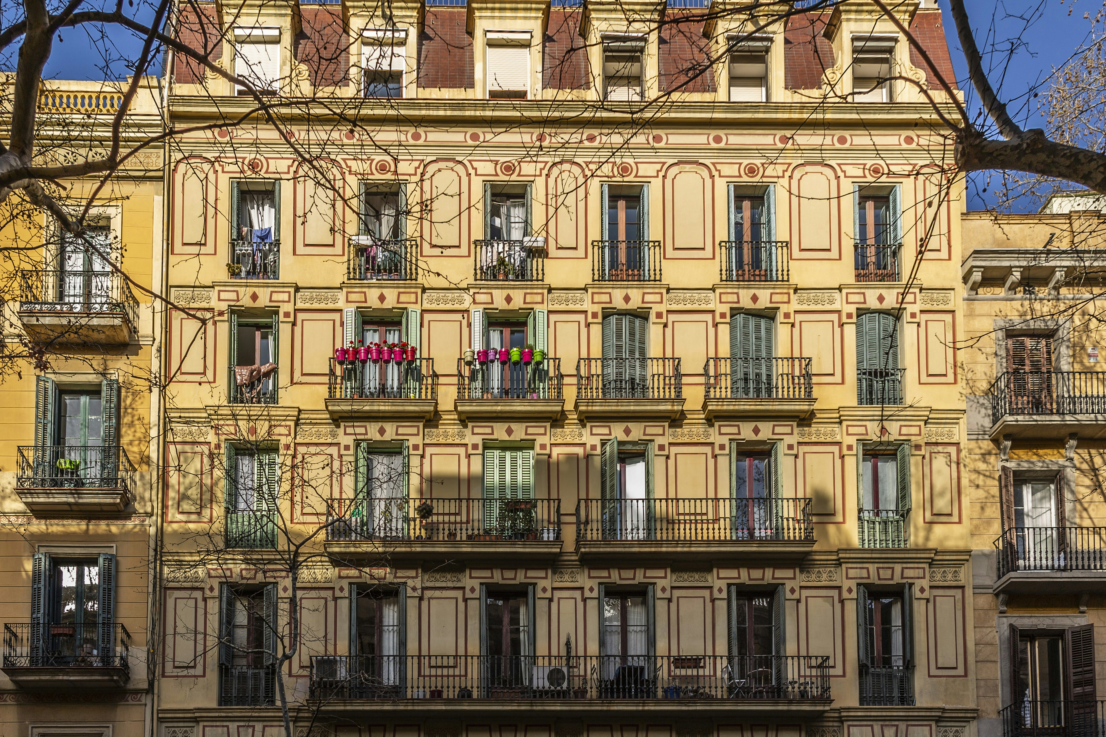 a tall building with lots of windows and balconies