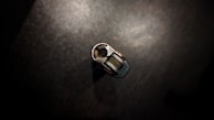 Hands holding a key and lock mechanism during repair.