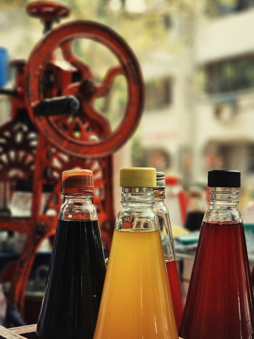 a group of bottles filled with liquid sitting on top of a table