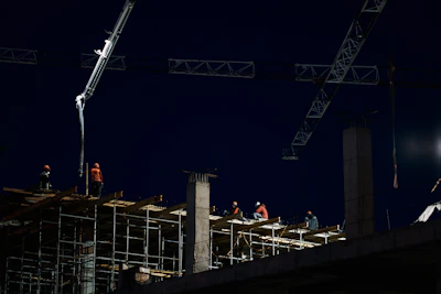 Security personnel monitoring a construction site at dusk with clear visibility.