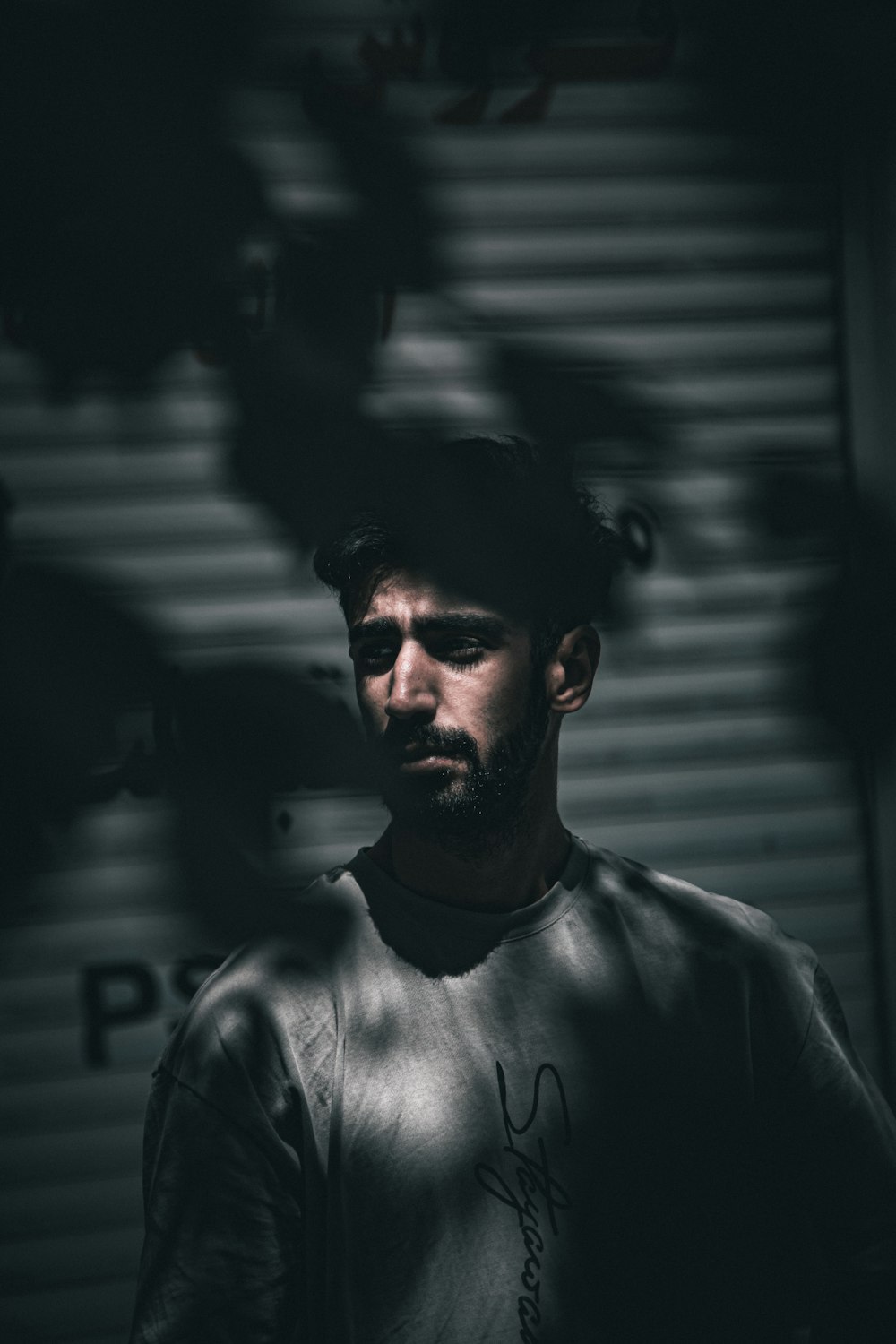 a man standing in front of a garage door