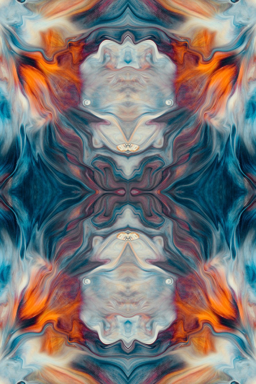an abstract image of an orange and blue flower