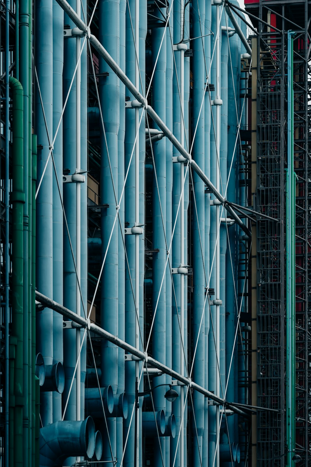 a very tall building with a bunch of pipes attached to it