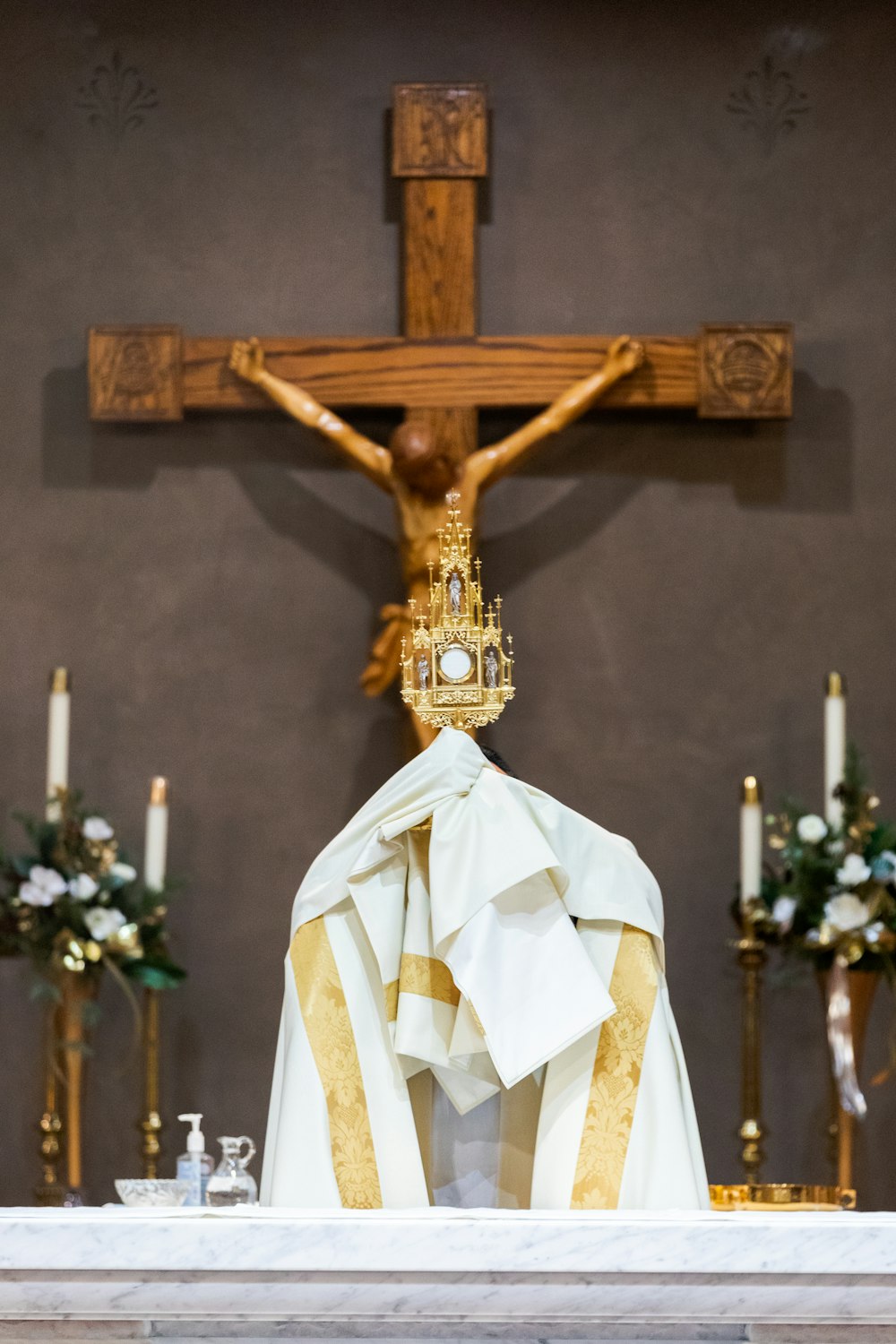 a statue of a crucifix with a cloth draped over it