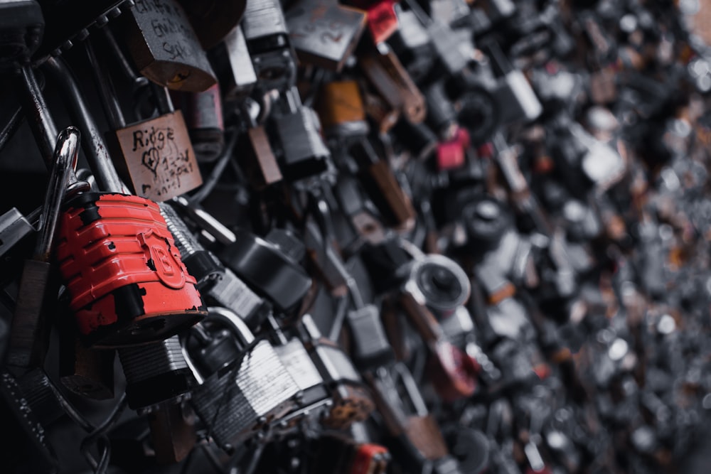 a wall covered with lots of padlocks and locks