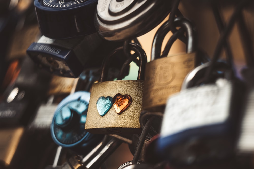 a close up of a padlock with two hearts on it