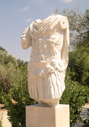 a statue of a man in a white outfit