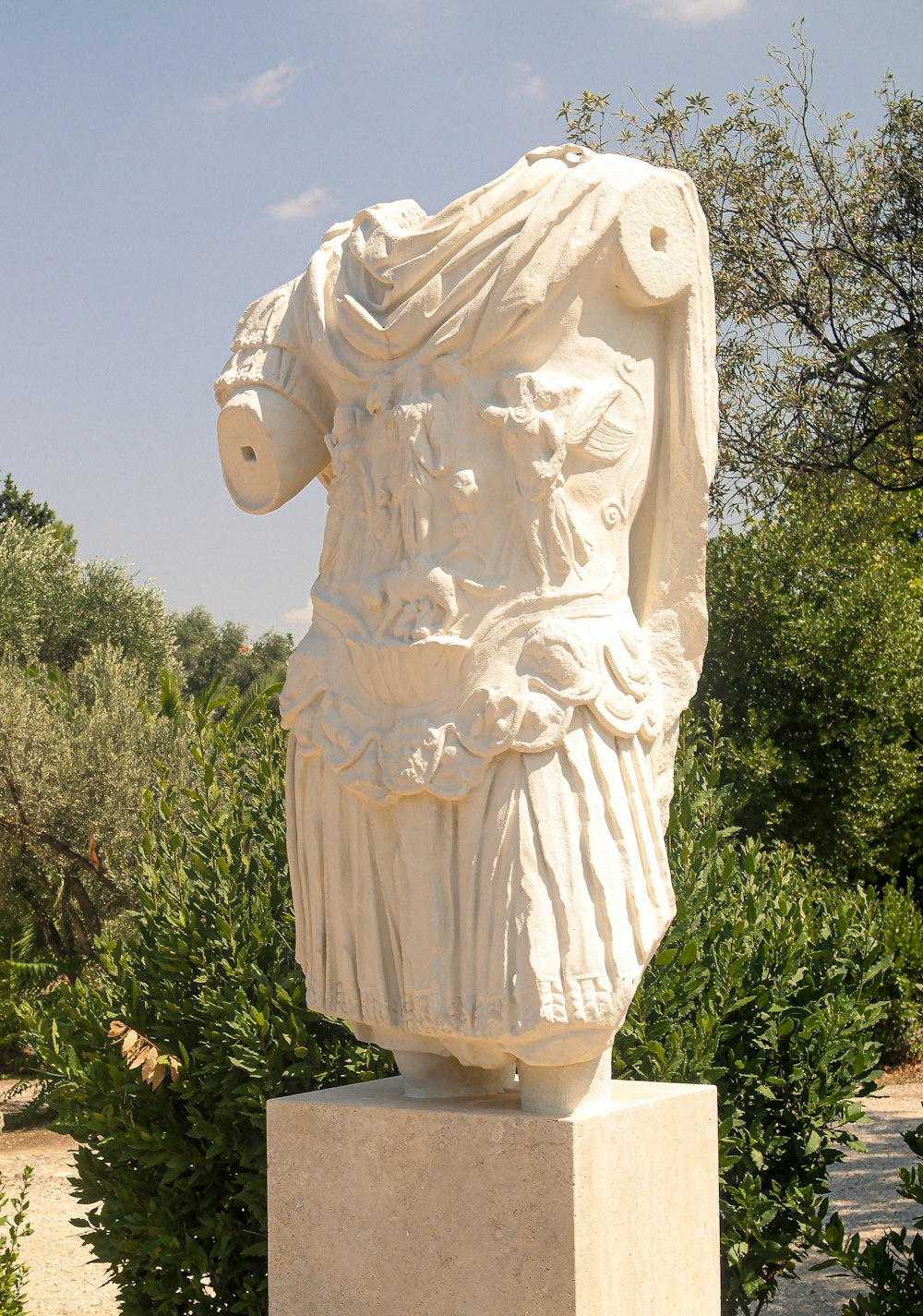 a statue of a man in a white outfit