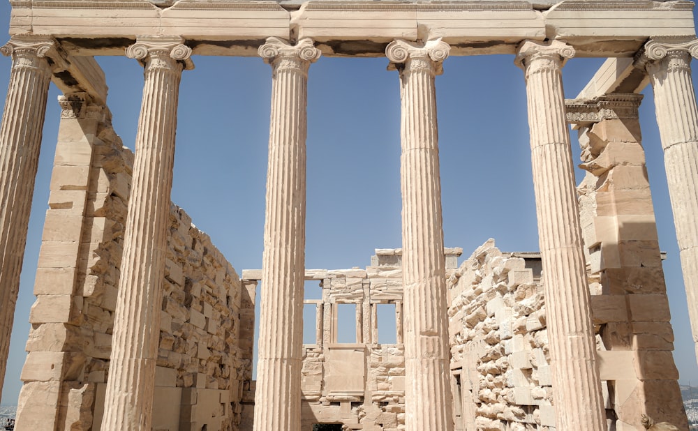 a group of pillars in front of a building