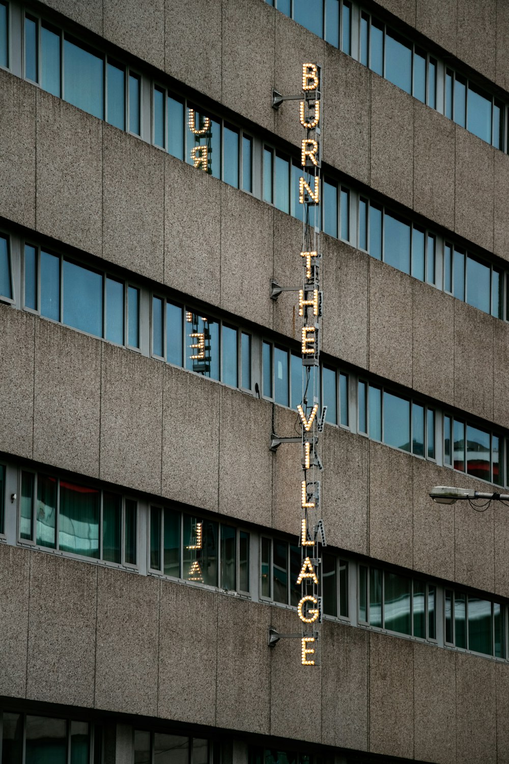 a tall building with a sign on the side of it