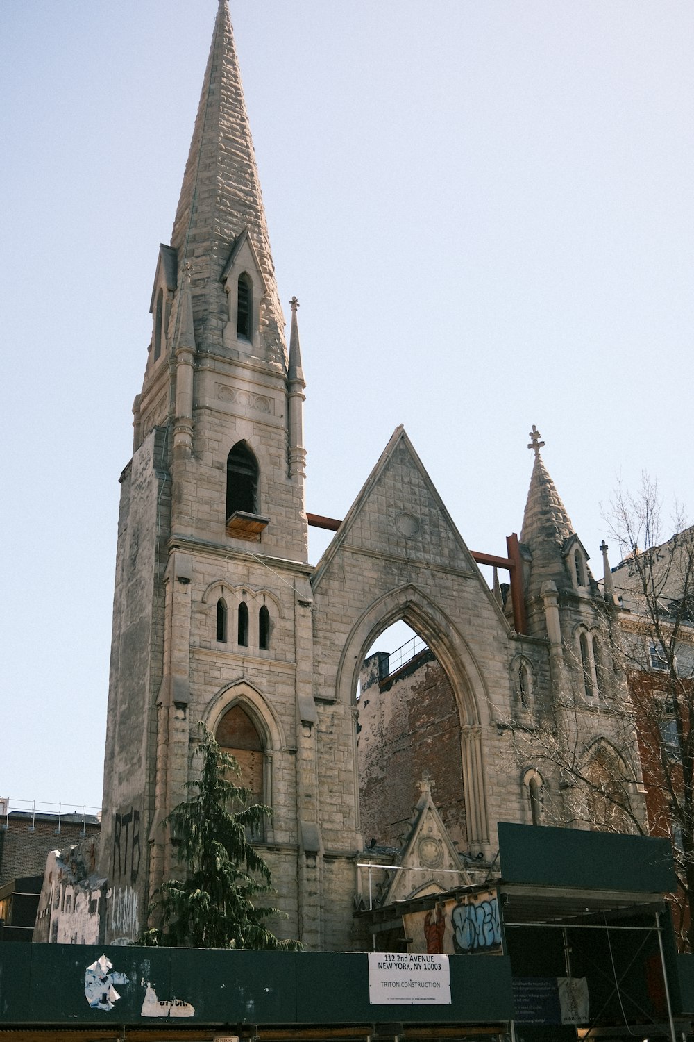 an old church with a steeple and a clock tower