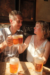 Sunlit cozy brewery corner with friends sharing craft beers and laughter